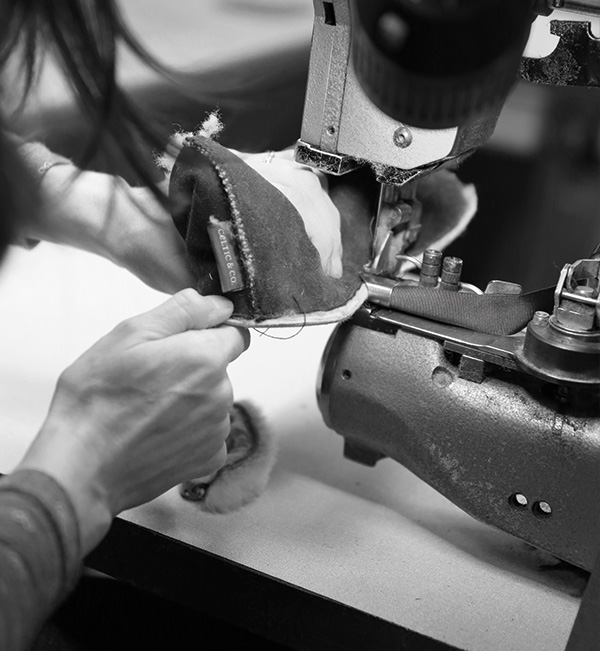 Hand sewing a sheepskin bootee