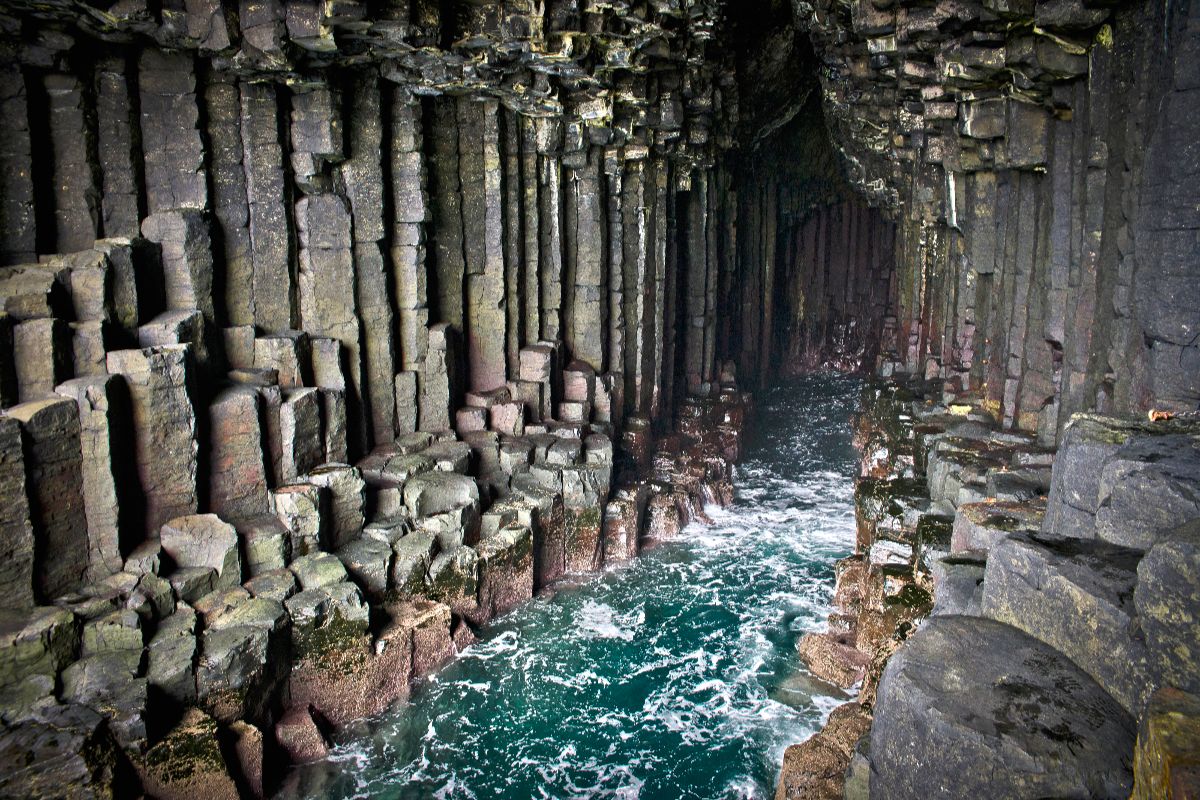Hexagonal columns in natural caves with sea water flowing through.