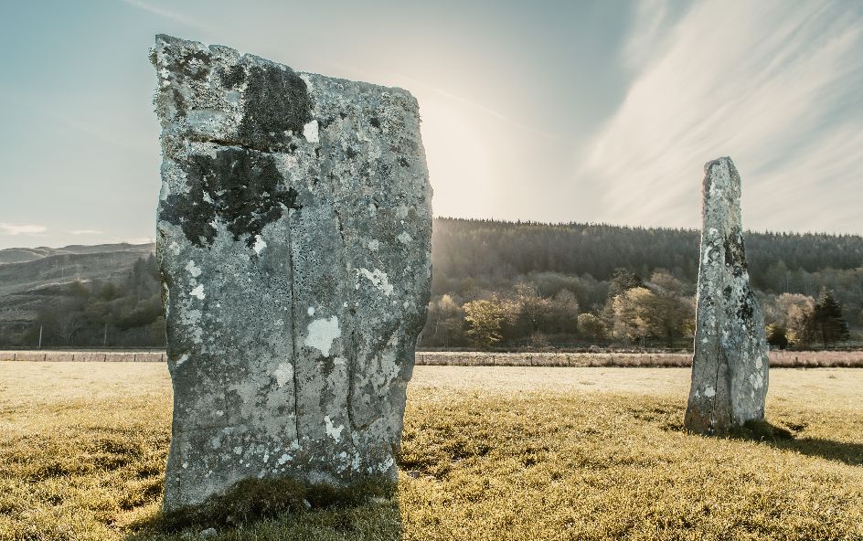 Historical standing stone shielded in glass cage.