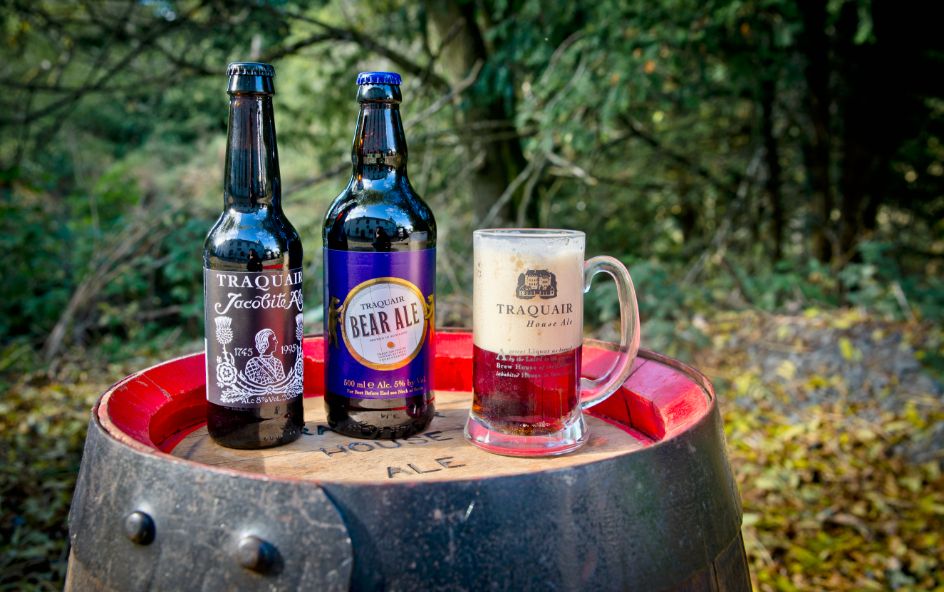 Two bottles of beer on a barrel