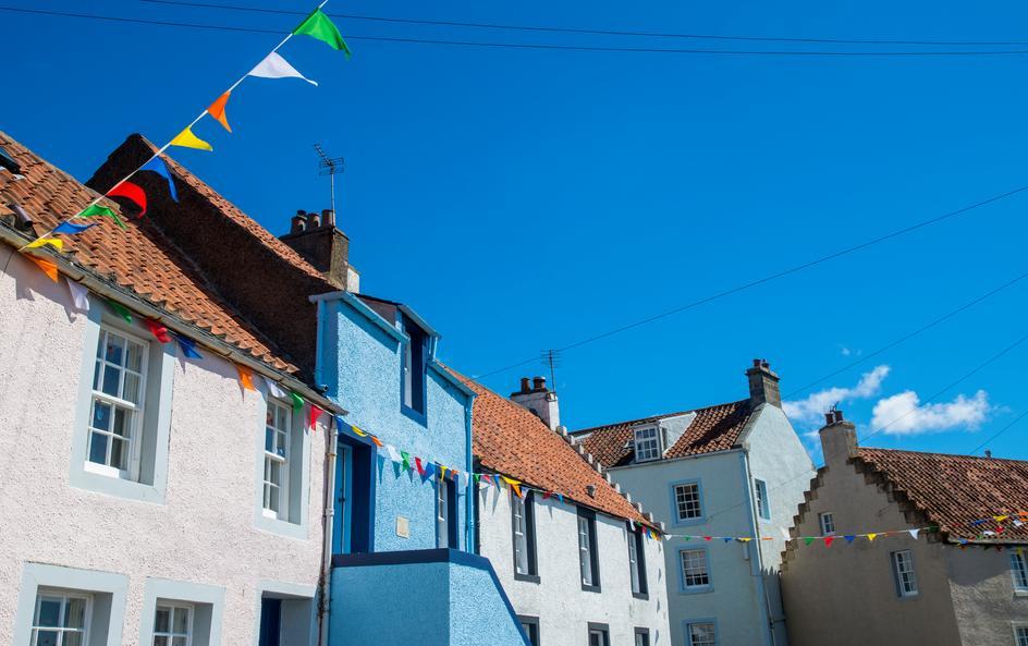 White and blue houses, with colourful bunting.