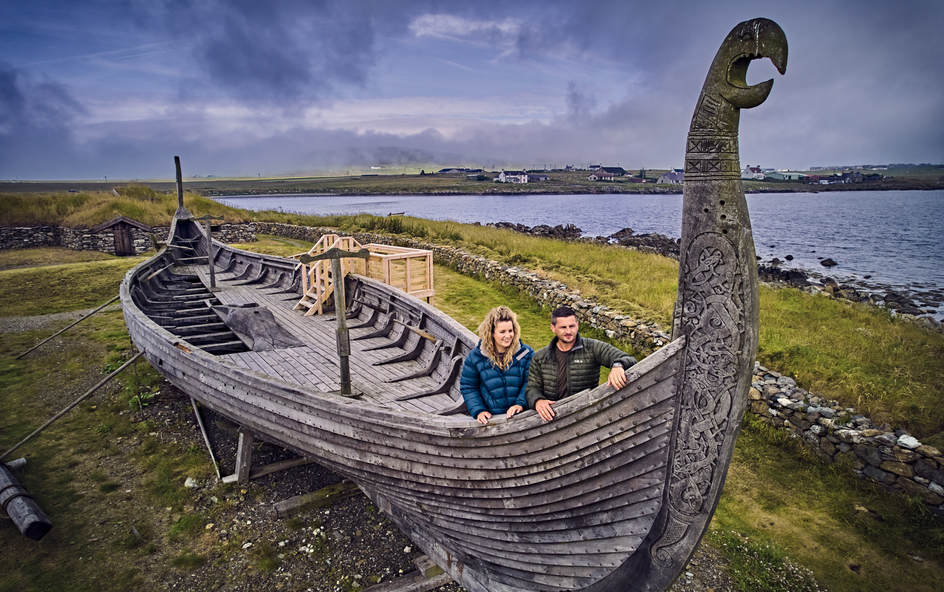 A couple of people in Viking boat