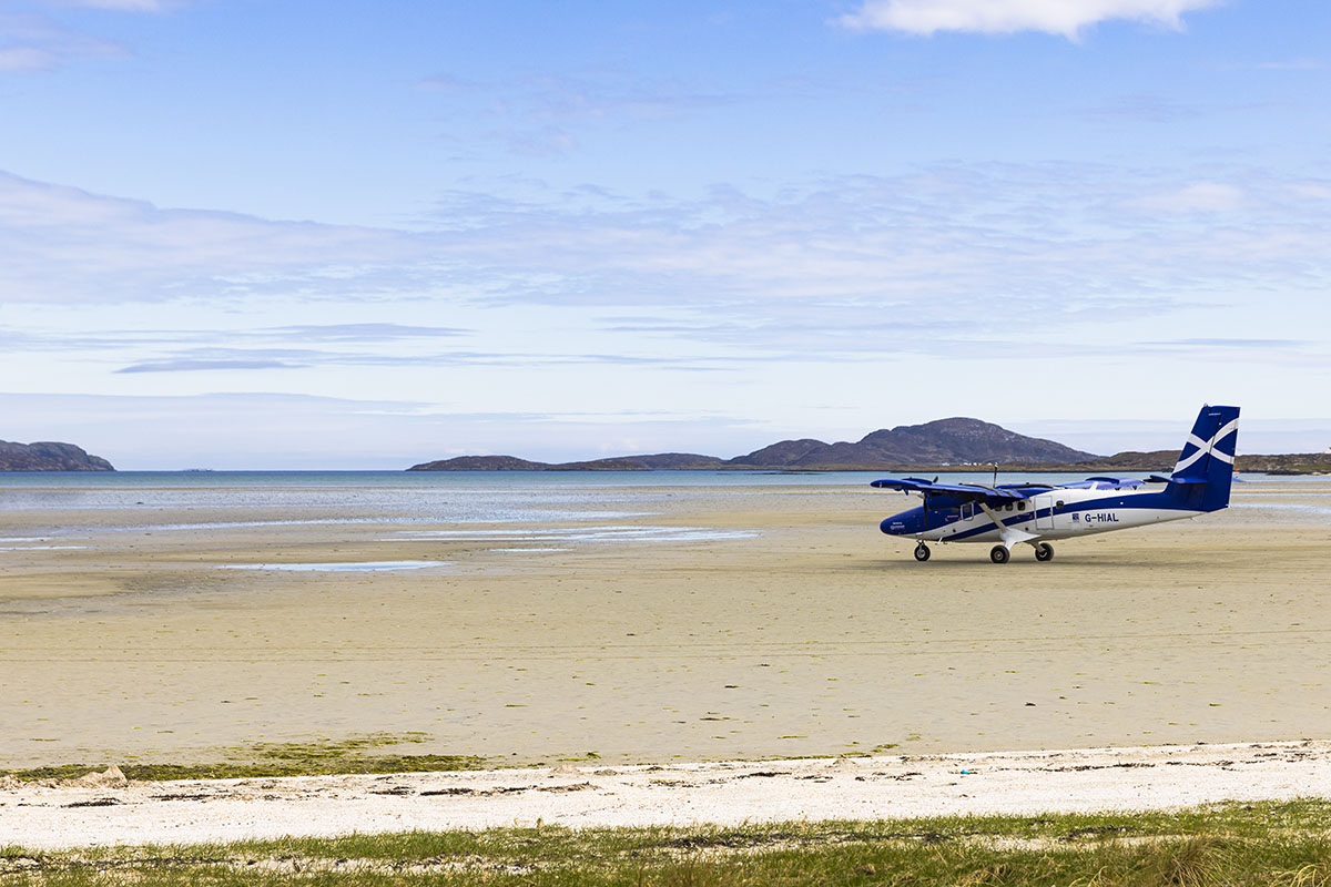 A plane sitting on a beach