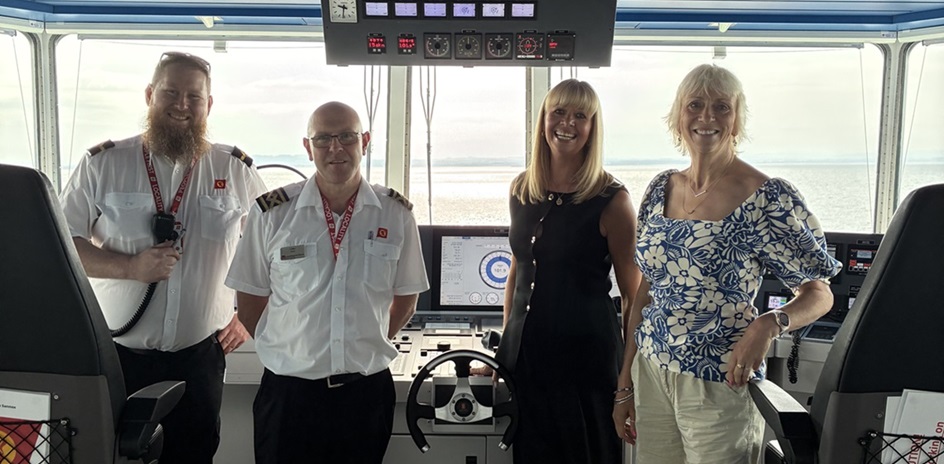 Vicki Miller and VisitArran Chief Executive, Sheila Gilmore, with crew from the Glen Sannox