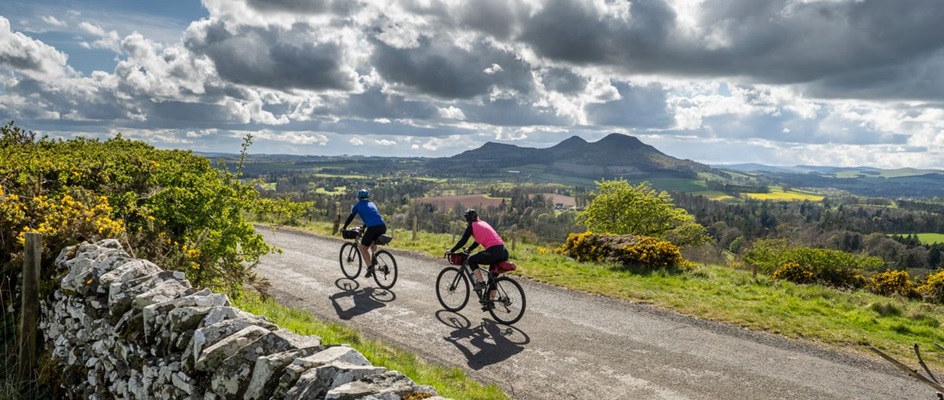 Cyclists with the Eildon Hills in the distance, Scottish Borders. SSDA © 