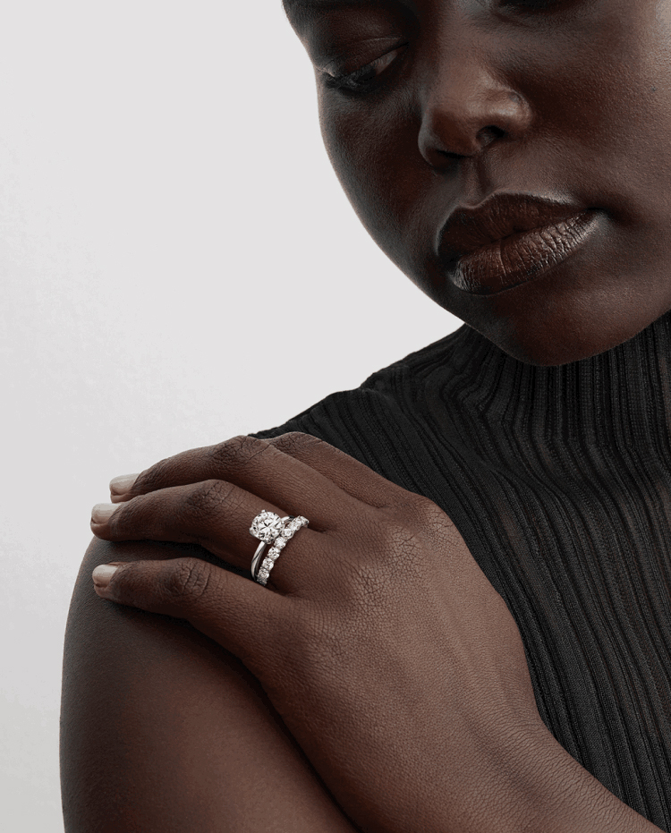 Model wears Pandora Era layered lab-grown diamond rings