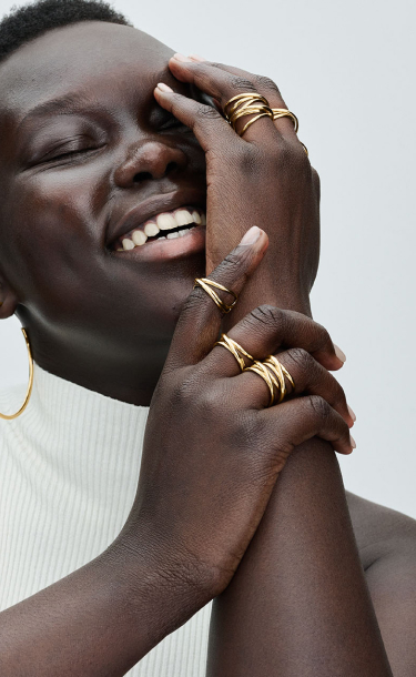 Our model wears statement rings from PANDORA ESSENCE