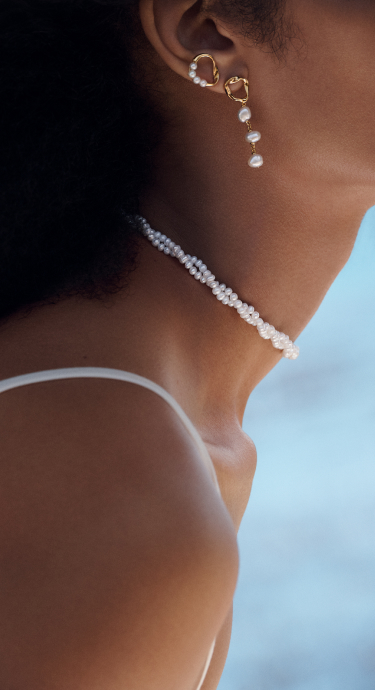 Model wears new PANDORA ESSENCE jewelry