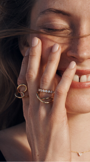 Model wearing Pandora rings 