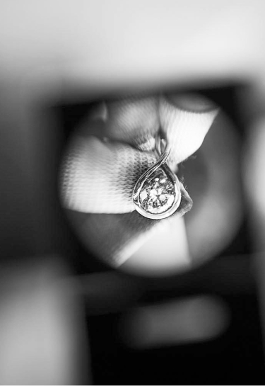 A lab-grown diamond seen through a jeweller's loupe