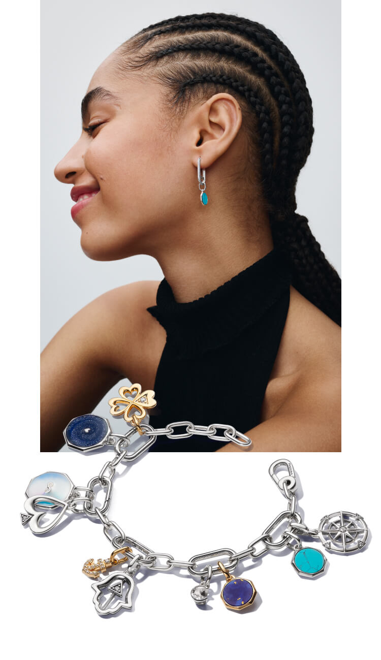 Model wearing Pandora ME mini medallion charms on earrings.