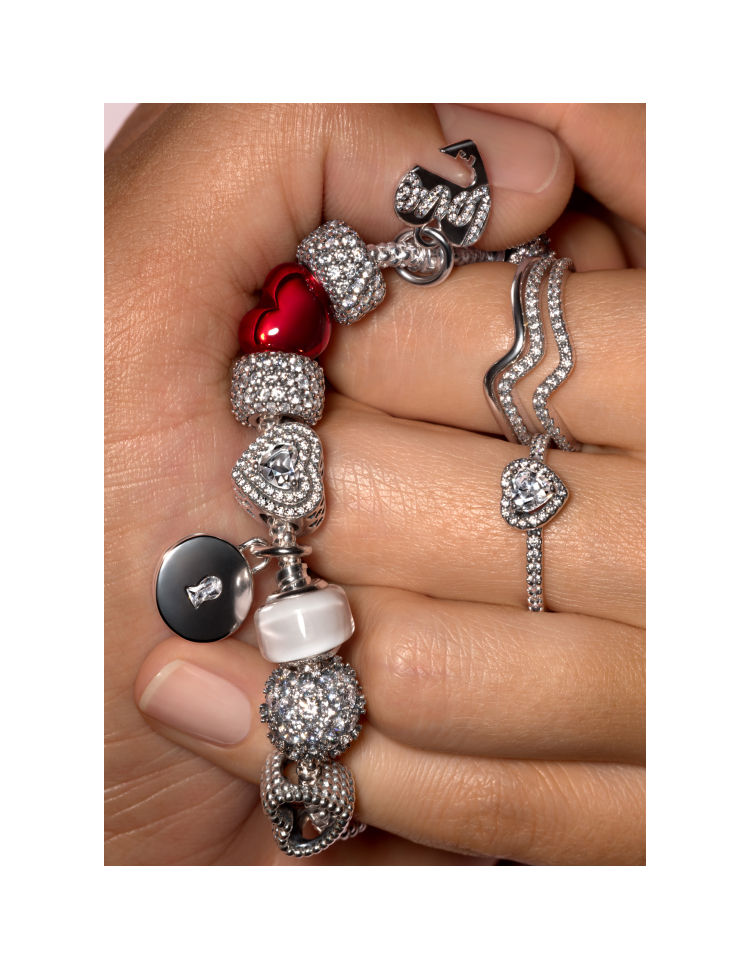 Hands wearing Pandora jewelry