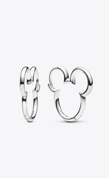 Model wears new Disney x Pandora Mickey Mouse silhouette earrings