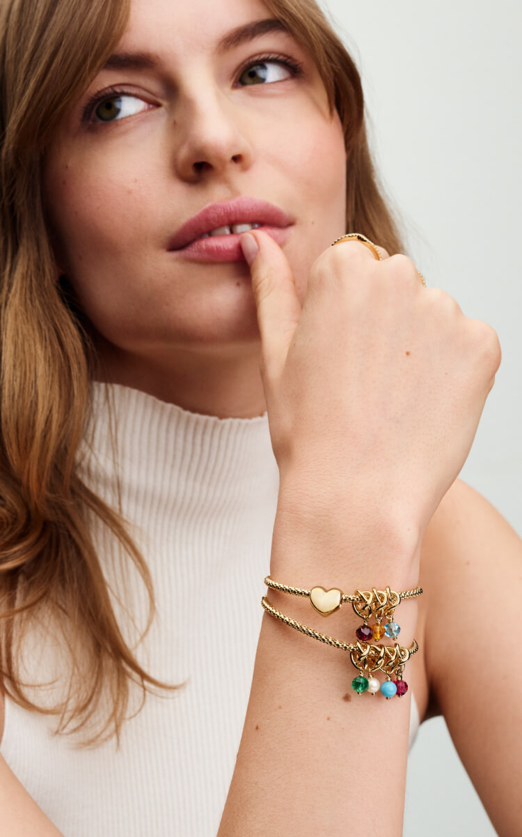 A model wears our most iconic Pandora charms 