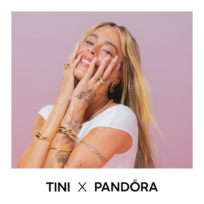 A model poses in 14k gold-plated Pandora jewellery.