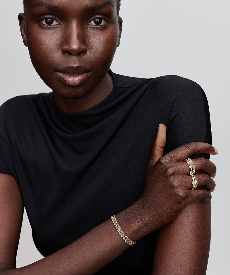 Model wearing Pandora Timeless rings and bracelets