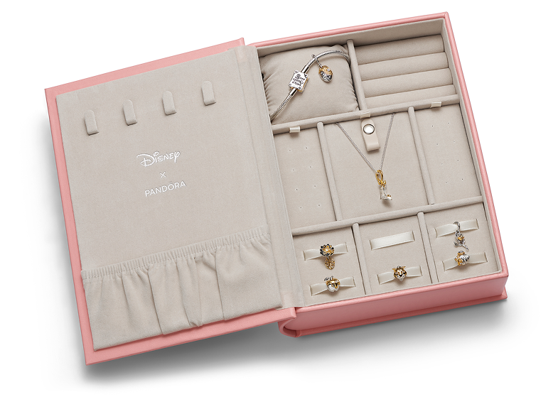 A pink Disney x Pandora jewellery box opened up with a bracelet and necklace displayed inside