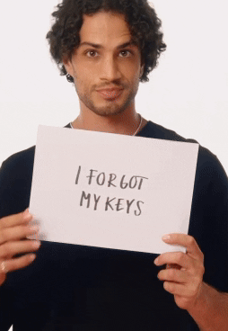 Man holding handwritten signs