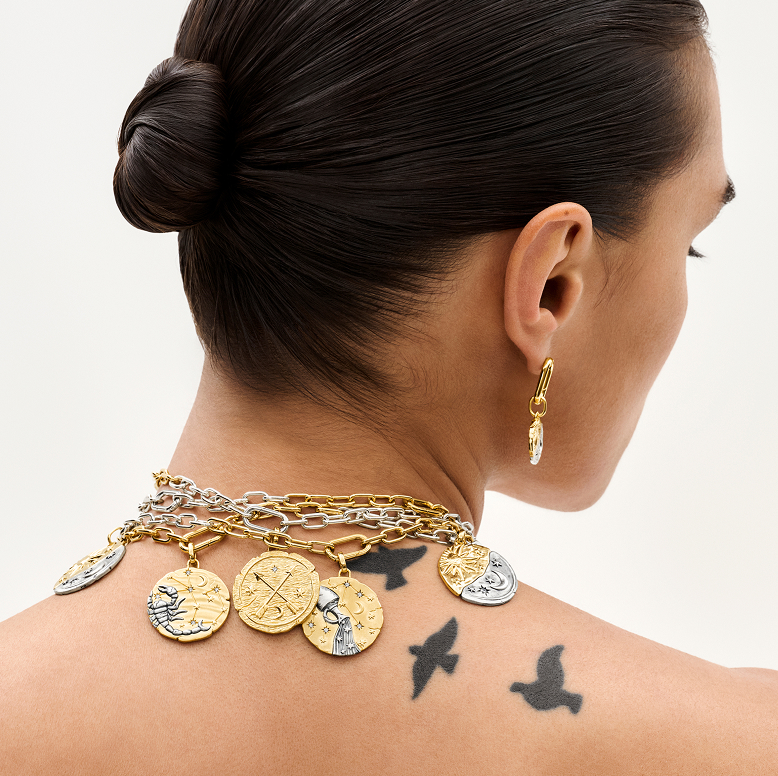 Model wears Pandora Talisman medallions.