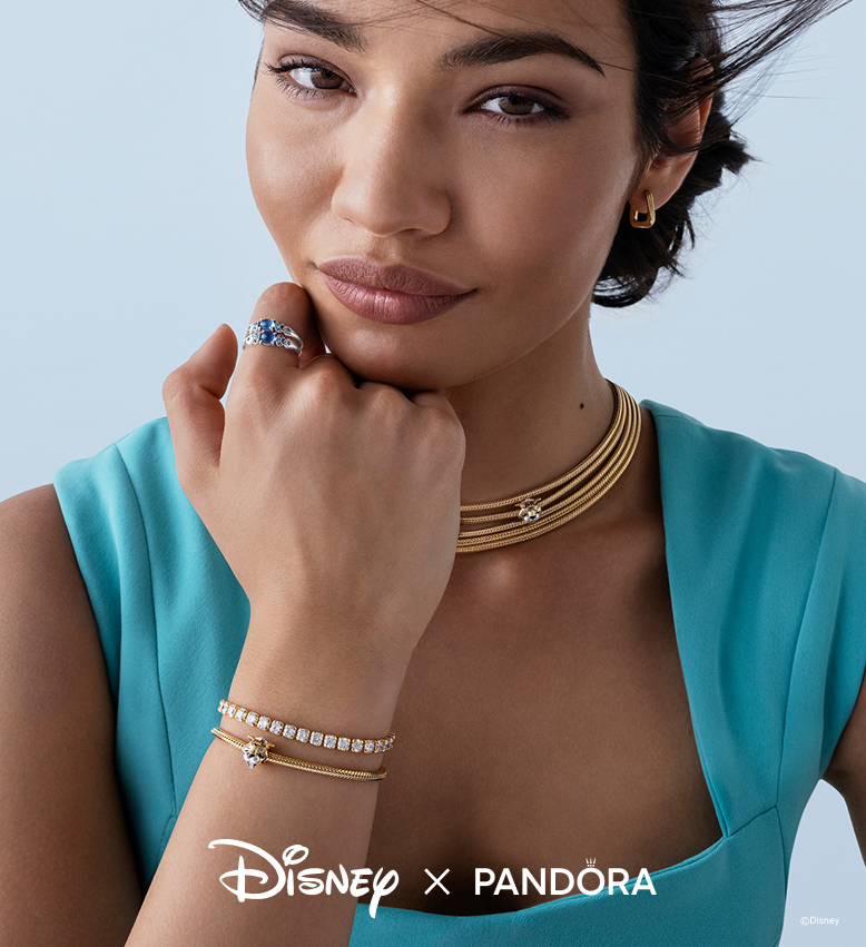 Image showing a model dressed as Princess Jasmine. She wears Jasmine rings, a necklace and bracelet with tiger charms and a sparkling tennis bracelet. 