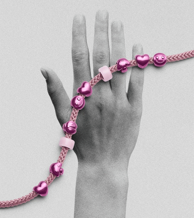 GIF jumping between different minis styled on bracelets, overlayed over an image of a hand