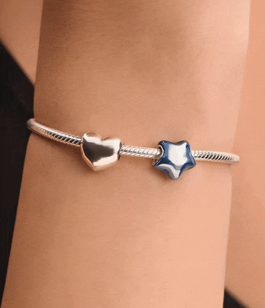 New Pandora for UNICEF star charm styled on our sterling silver snake chain bracelet