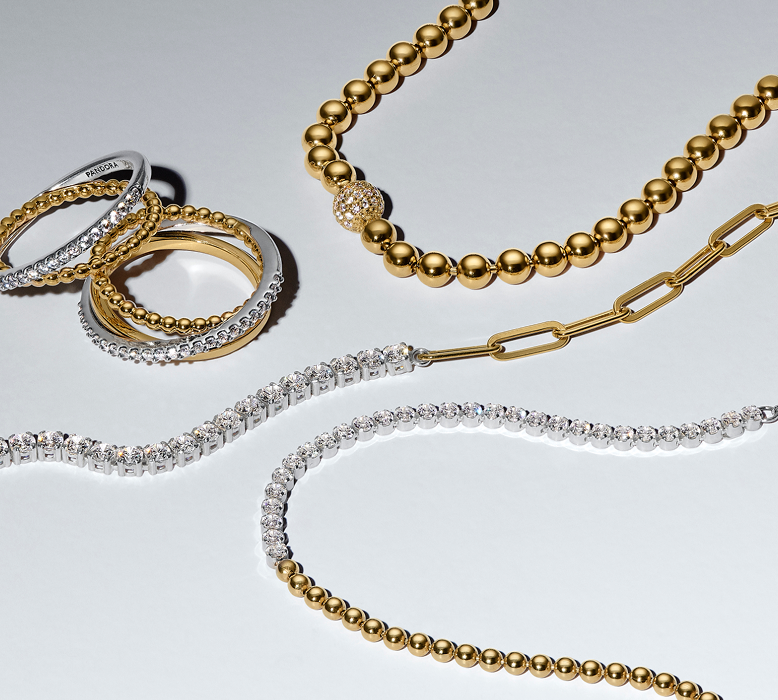 Close up of signature jewellery with contrasting metals and textures