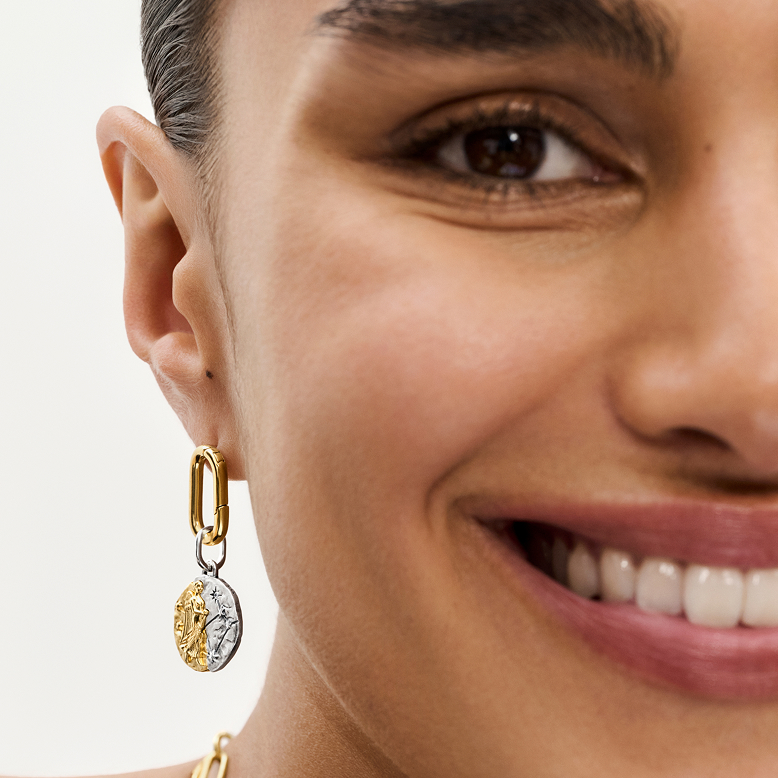 A model styles Pandora Talisman jewellery.