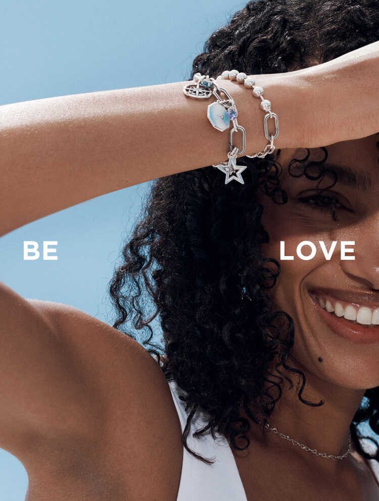 Model wearing mixed-metal Pandora jewellery