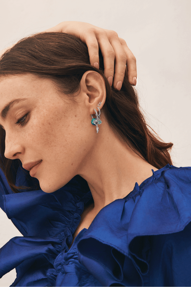Model wearing Earrings with charms