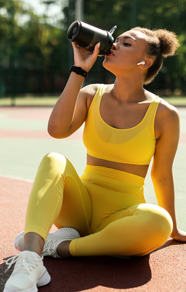 Woman Drinking After Workout